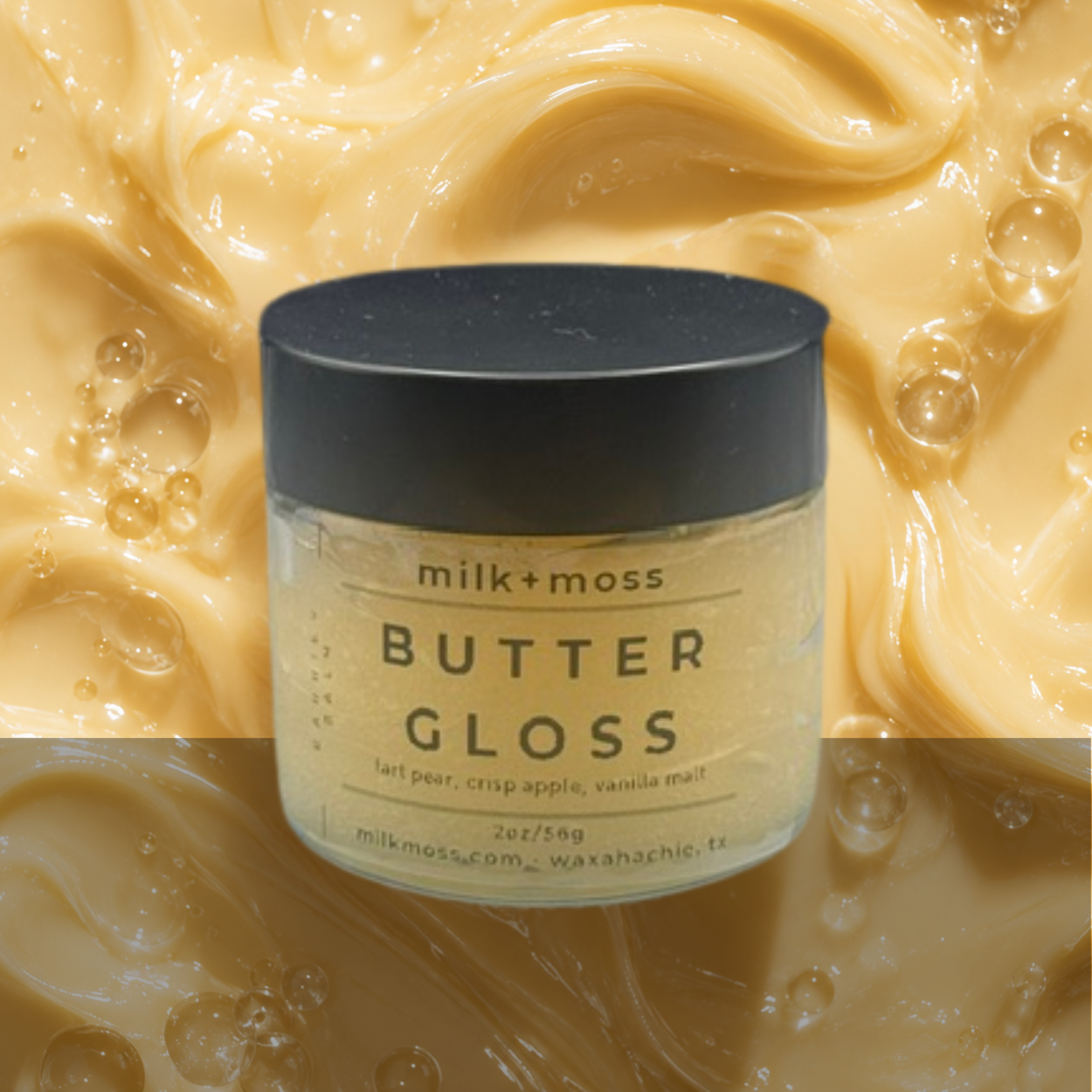 Jar of 'Butter Gloss' by milk+moss on a background of creamy texture
